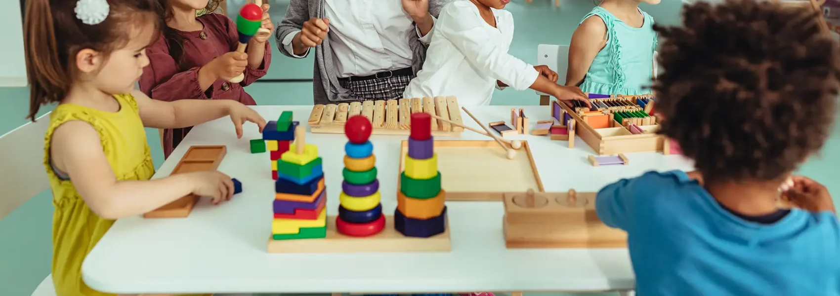students being creative in a classroom with teacher
