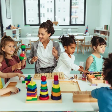 students being creative in a classroom with teacher